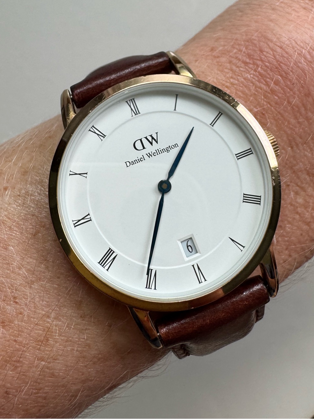 Daniel Wellington White Dial Watch With Gold Case And Brown Leather Strap